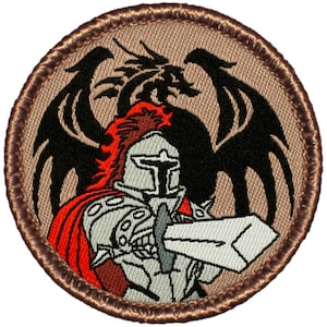May include: A brown embroidered patch with a knight in silver armor holding a sword, with a black dragon behind the knight. The knight has a red cape and a red and white helmet.