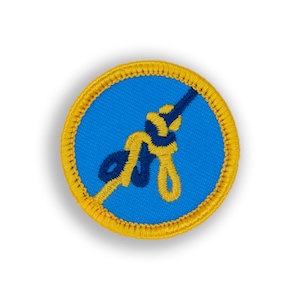 May include: A yellow and blue embroidered patch with a knot tied in a rope. The knot is in the shape of a figure eight.