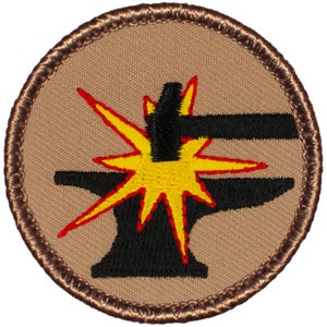 May include: A brown embroidered patch with a black anvil and hammer, with a yellow and red spark effect.