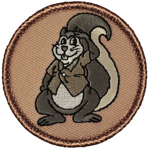 May include: A brown embroidered patch with a cartoon squirrel wearing a vest and bowtie. The squirrel is smiling and has a bushy tail.
