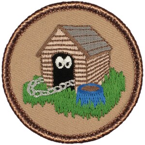 May include: A brown and tan embroidered patch with a dog house, a chain, and a blue water bowl. The dog house has two black eyes peering out from the doorway.