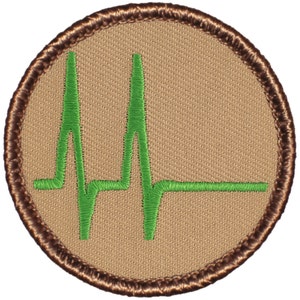 May include: A round, brown embroidered patch with a green EKG heart rate line in the center.