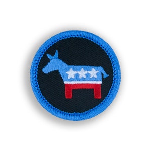 May include: A blue and red embroidered donkey with white stars on a black background. The donkey is surrounded by a blue stitched border.