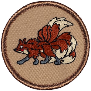 May include: Embroidered patch featuring a red fox with a large, bushy tail. The fox is depicted in a cartoon style with a friendly expression. The patch is circular and has a brown border.