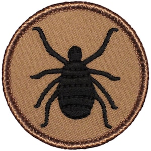 May include: A brown embroidered patch with a black tick silhouette.