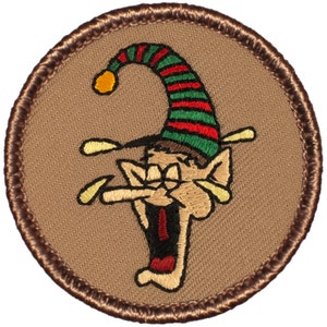 May include: A brown embroidered patch with a cartoon elf wearing a red and green striped hat with a yellow pom-pom. The elf is laughing with its mouth open and its eyes closed.