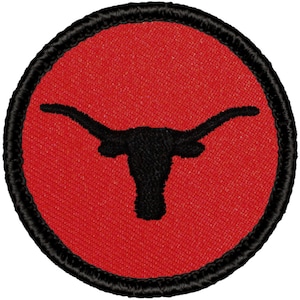 May include: A red and black embroidered patch with a longhorn steer silhouette.