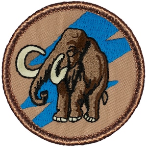May include: A brown embroidered patch with a blue lightning bolt design. The patch features a brown mammoth with a white tusk and a white crescent-shaped tusk.