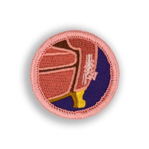 May include: A pink and brown embroidered patch with a chair on a purple background. The chair has a brown seat and a yellow leg.