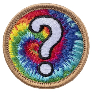 May include: A round, embroidered patch with a white question mark on a colorful tie-dye background. The patch has a brown border.