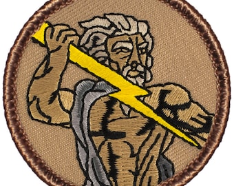 May include: Embroidered patch featuring a brown and yellow image of Zeus, the Greek god of thunder, holding a lightning bolt. The patch is circular and has a brown border.