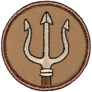 May include: A brown embroidered patch with a white trident design. The trident has three prongs and a brown handle.