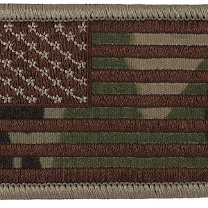 May include: A brown and green camouflage American flag patch with a gray border. The stars are white and the stripes are red and white.