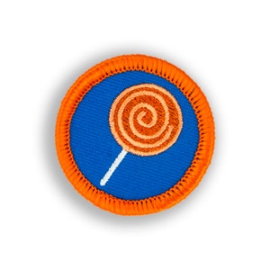 May include: Orange and white embroidered lollipop patch with a blue background and an orange border.