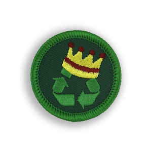 May include: A green embroidered patch with a recycling symbol and a yellow crown with red accents. The patch has a green stitched border.