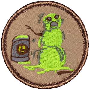May include: A green embroidered patch with a cartoon snowman and a can of paint. The snowman is melting and the paint is dripping. The patch is brown with a brown border.