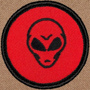 May include: Red embroidered patch with a black alien head design. The alien has large eyes and a serious expression.