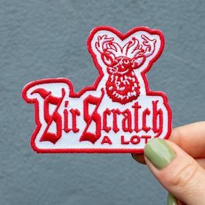 May include: Red and white embroidered patch with a cartoon deer and the text "Sir Scratch A Lot".