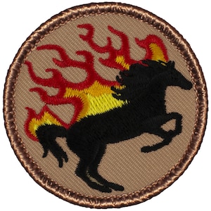 May include: A round embroidered patch with a brown background and a black horse with flames in red, yellow, and orange.