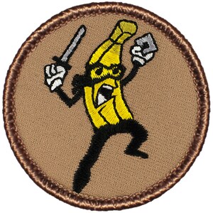 May include: A brown embroidered patch with a yellow banana character holding a knife and a gun. The banana is wearing a black suit and has a black mustache and sunglasses.