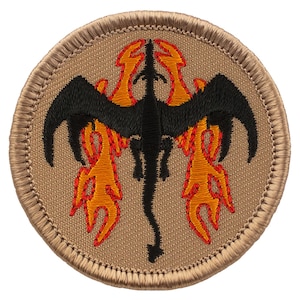 May include: A black dragon with orange flames embroidered on a tan background. The dragon is facing forward with its wings spread out. The patch is circular and has a tan border.