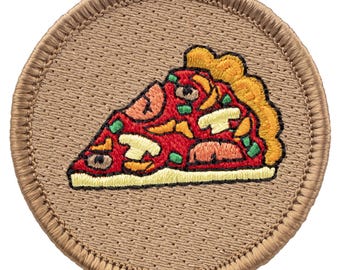 May include: A brown embroidered patch with a slice of pizza with red sauce, cheese, green peppers, and mushrooms.