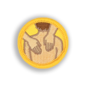 May include: A yellow embroidered patch with a brown outline depicting a person receiving a back massage.