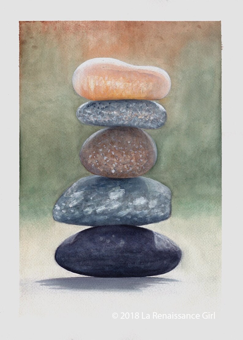 May include: A stack of five smooth, round stones in various shades of grey, brown, and beige, balanced on top of each other. The stones are arranged in a pyramid shape, with the largest stone at the bottom and the smallest stone at the top. The background is a soft, blurred green.