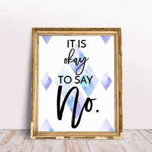 May include: A framed print with a white background and a blue and purple watercolor design. The print features the text "It is okay to say No."