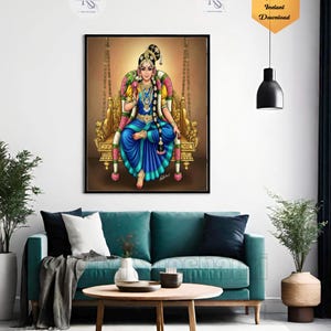 May include: A framed digital print featuring a woman in traditional Indian attire seated on a golden swing. The woman wears a blue dress and ornate jewelry. The print is displayed above a teal sofa in a modern living room setting.