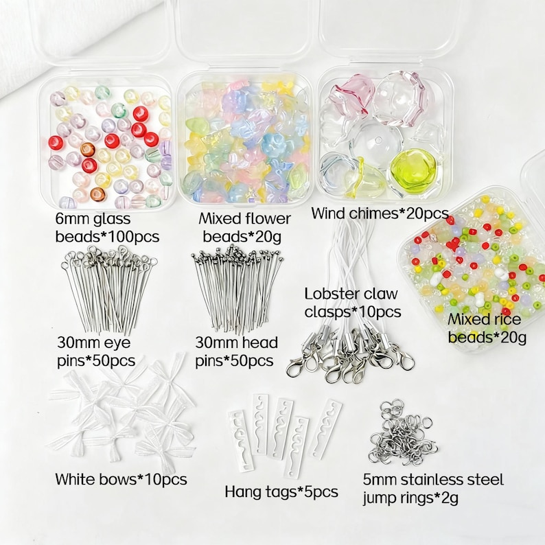May include: A selection of craft supplies, including clear plastic containers filled with colourful beads, wind chimes, and clasps. The image also shows eye pins, head pins, white bows, hang tags, and jump rings. Text on the image indicates the quantity and size of each item.