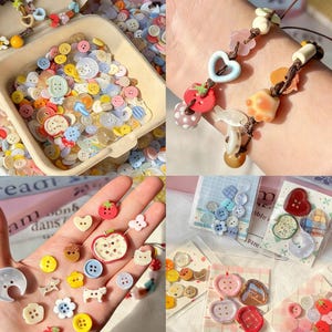 May include: A collection of colorful buttons in various shapes and sizes, including hearts, flowers, and fruits. Some buttons are loose in a container, while others are displayed on cards or used in a bracelet. The buttons are in shades of pink, yellow, blue, and red.