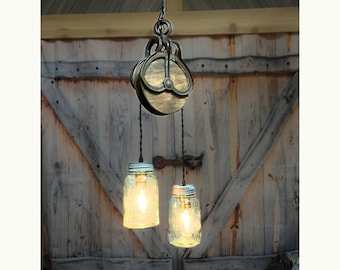 Rustic farmhouse pendant lighting, with antique farm pulley and vintage mason jar lights, cabin style for kitchen, dining room