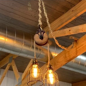 Rustic farmhouse pulley lighting, pendant light with antique pulley for cabin decor, repurposed vintage pulley for kitchen / dining room