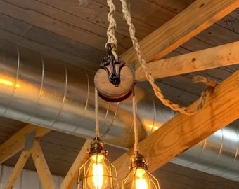 Rustic farmhouse pulley lighting, pendant light with antique pulley for cabin decor, repurposed vintage pulley for kitchen / dining room