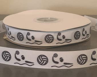 May include: White ribbon with a repeating pattern of black water polo players and volleyballs.