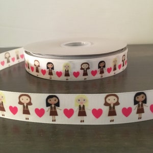 May include: White ribbon with a repeating pattern of brown cartoon girls holding pink hearts. The girls have different hair colors and are wearing brown vests.
