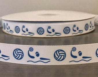 May include: White ribbon with a repeating pattern of blue water polo players and volleyballs.