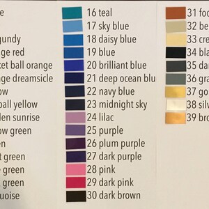 May include: A color chart with 39 different colors, each with a number and a name. The colors are arranged in three columns. The first column includes colors like white, red, burgundy, orange red, basket ball orange, orange dreamsicle, yellow, softball yellow, golden sunrise, yellow green, green, mint green, lime green, dark green, and turquoise. The second column includes colors like teal, sky blue, daisy blue, blue, brilliant blue, deep ocean blue, navy blue, midnight sky, lilac, purple, plum purple, dark purple, pink, dark pink, and dark brown. The third column includes colors like football brown, beige, cream, black, dark gray, gray, gold, silver, and bronze.