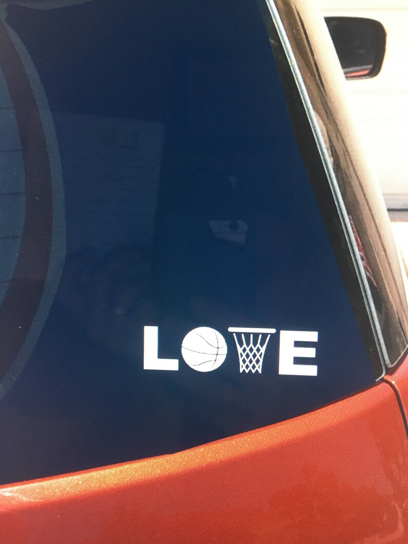 May include: A white vinyl decal with the word "LOVE" with a basketball and a basketball hoop replacing the "O".