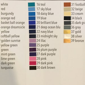 May include: A color chart with 39 different paint colors, numbered and labeled with their names. The colors are arranged in three columns, with the first column containing shades of red, orange, yellow, and green, the second column containing shades of blue, purple, and pink, and the third column containing shades of brown, beige, gray, and metallic colors.