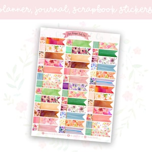May include: A sheet of colorful floral patterned stickers with gold accents. The stickers are shaped like banners and are designed for planners, journals, and scrapbooks. The text "The Crafter's Get Co." is printed at the top of the sheet.
