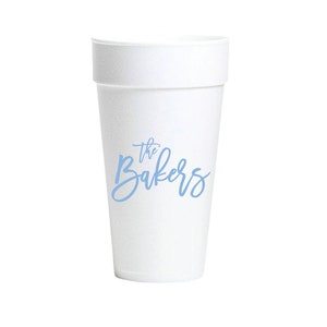 May include: White foam cup with a blue inscription that reads "the Bakers".