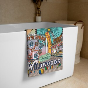 May include: A colourful illustration of a beach scene with a Ferris wheel, boardwalk, and the text "It's 80's long - the HOLLYWOOD of the EAST COAST - WILDWOODS".