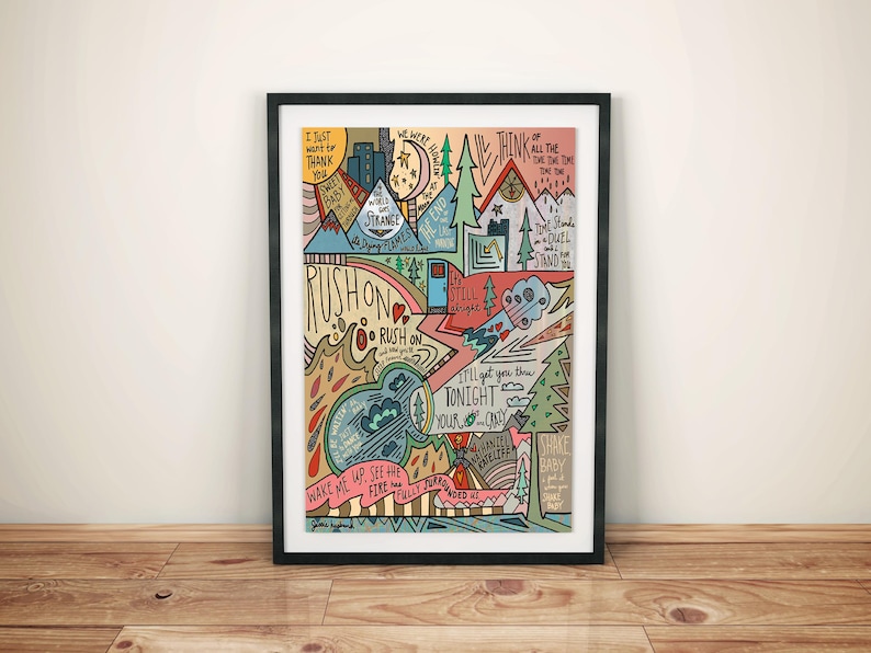 May include: A colourful illustrated print featuring a mountain landscape and lyrics from the song "Rush On" by the band "The 1975". The lyrics include "I just want to thank you", "We were hearts", "Think of all the time", "The world was strange", "Rush on", "I'll get you through tonight", "Wake me up, see the fire", "Shake baby, got you in my heart".