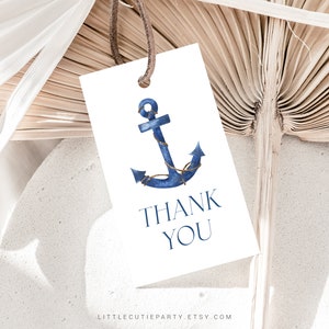 May include: A white thank you tag with a blue watercolour anchor and the text "Thank You".