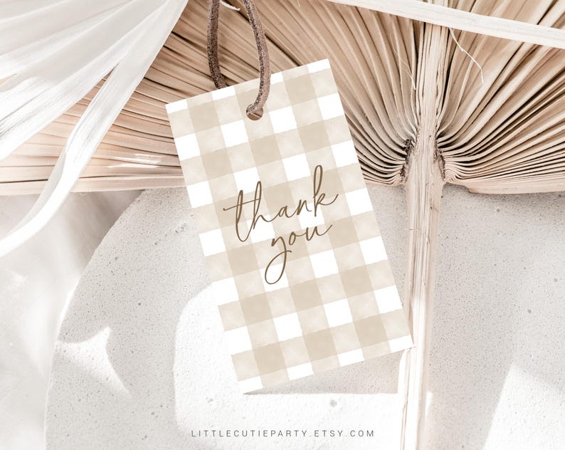 May include: A brown and white gingham thank you tag with the words "thank you" written in brown cursive script.