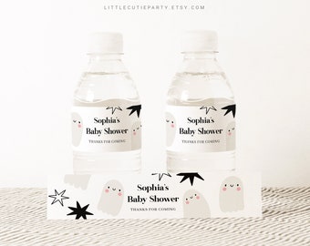 May include: Two clear water bottles with white labels featuring a ghost and star design, with the text "Sophia's Baby Shower" and "Thanks for Coming." A matching label is below the bottles. The bottles have white caps.