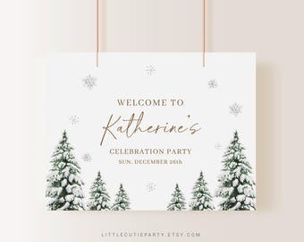 May include: A white sign with the text "Welcome to Katherine's Celebration Party" in brown script. The sign features illustrations of snow-covered evergreen trees and snowflakes. The date "Sun, December 26th" is also displayed.