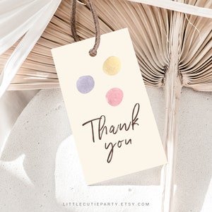 May include: A beige thank you tag with three watercolor dots in purple, pink, and yellow. The text "Thank you" is written in brown cursive.